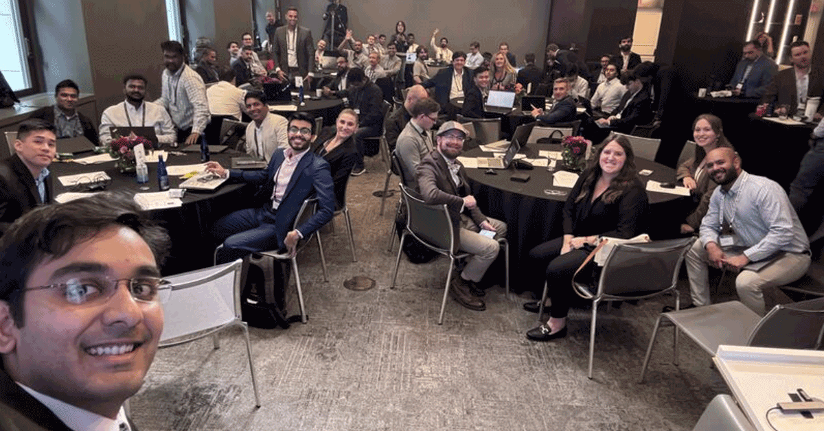 A group picture of smiling hackathon participants